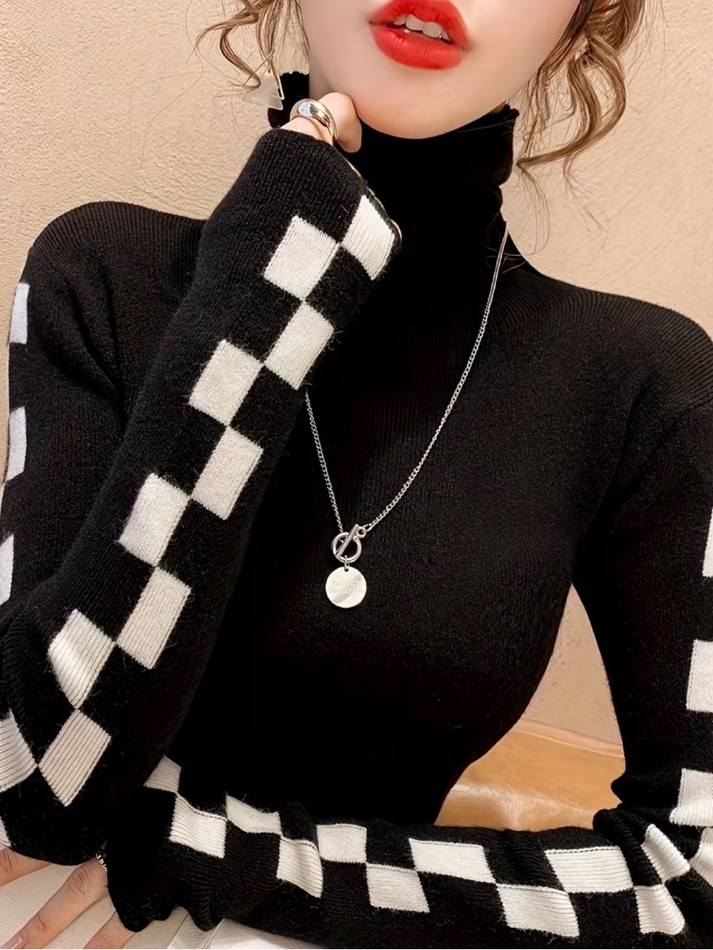 Black Turtleneck Sweater with Black & White Checkerboard Sleeve Detail